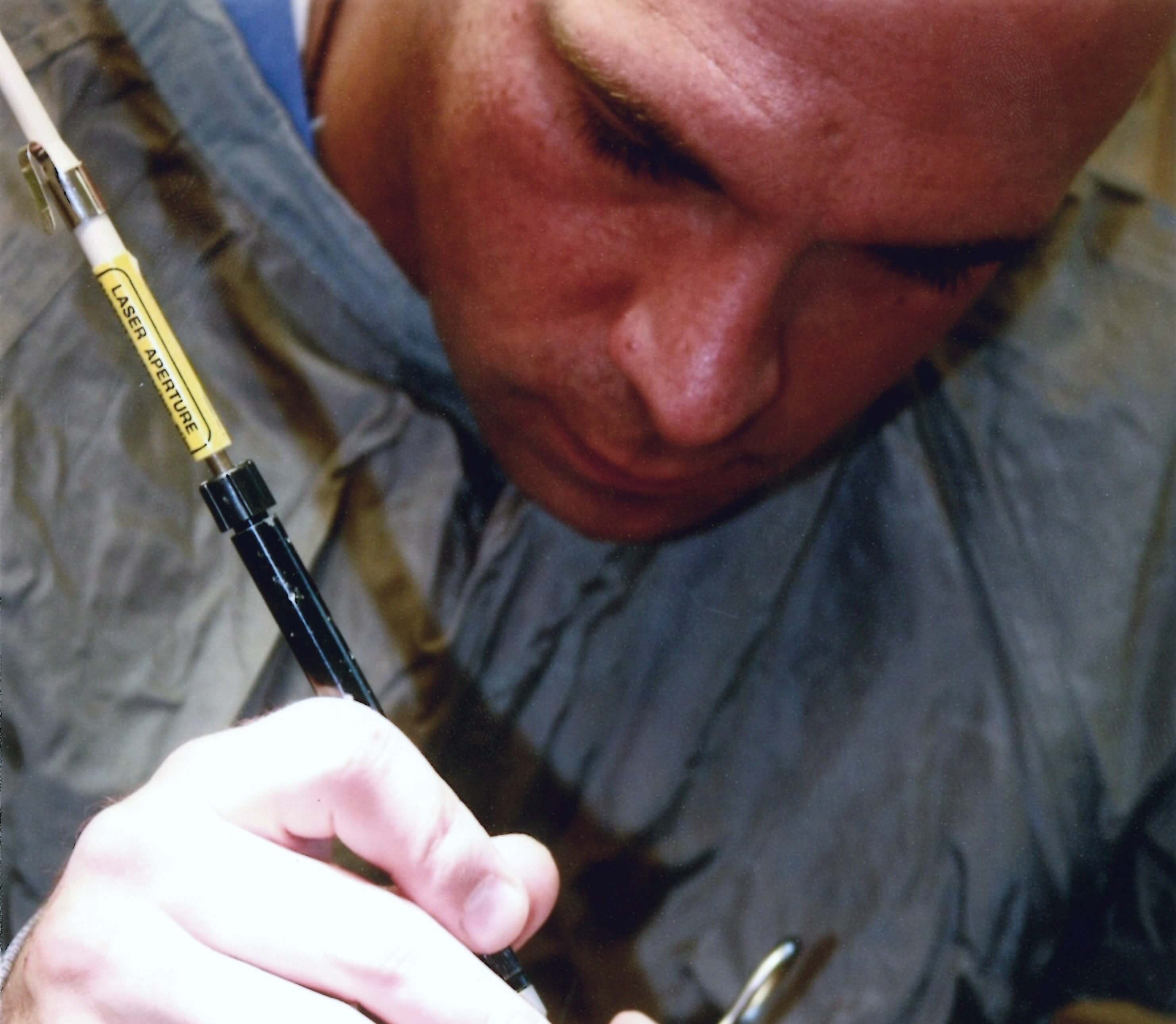 Veterinarian performing laser surgery